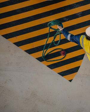 A Construction Worker Holding A Rope - San Francisco Compensation Lawyer -Boxer & Gerson, LLP